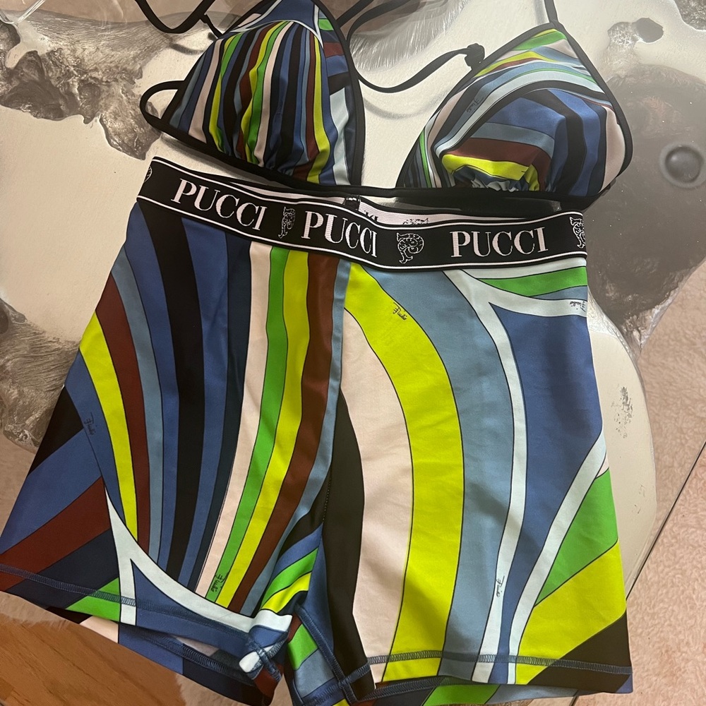 Worn once bikini top and swim shorts .